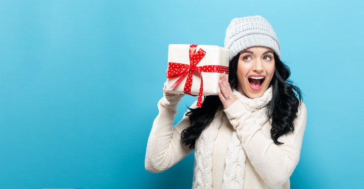 Woman excited about home security holiday gifts.